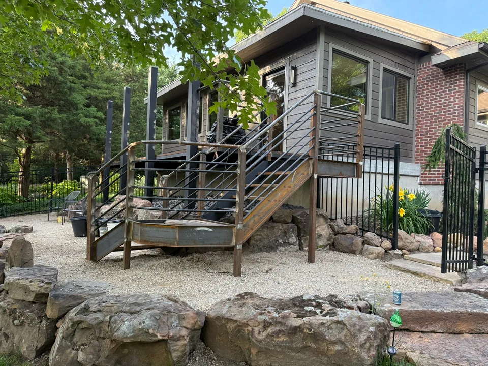 Exterior steel staircase and railing structure during fabrication