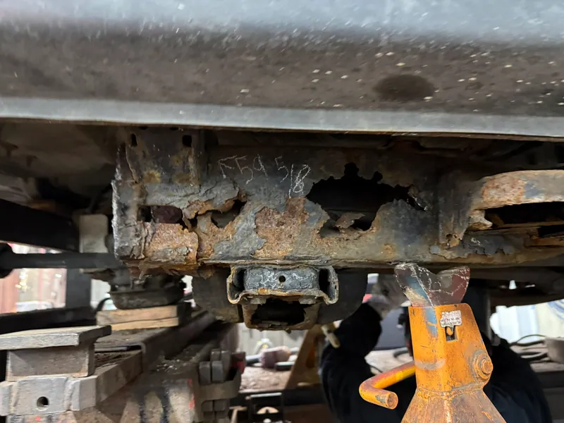 Severe perforating corrosion in a truck frame rail near a mounting point