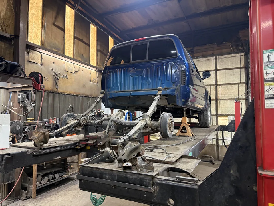 Truck chassis repair work in progress inside the shop