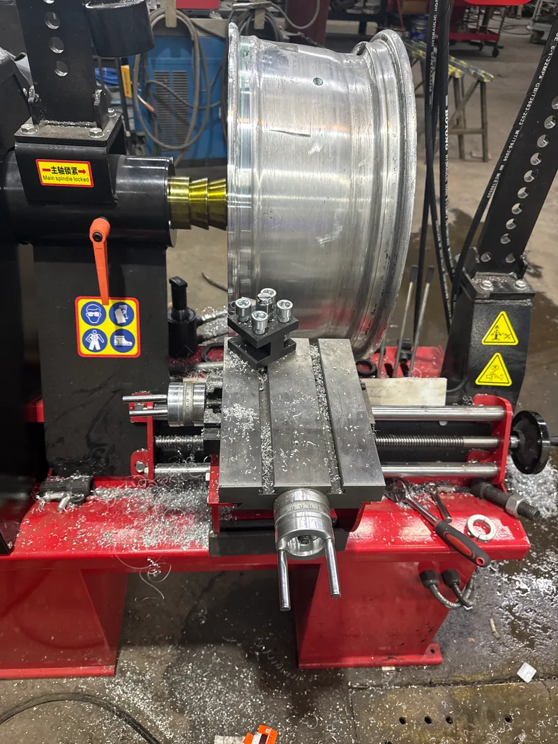 Wheel mounted on wheel-service equipment during repair